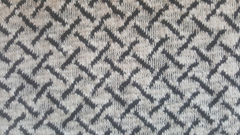 Strickstoff flechtmuster schwarz ecru